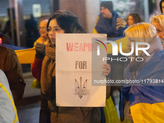 Two hundred people take part in a demonstration to mark 1,000 days since the full-scale war between Ukraine and Russia in Cologne, Germany,...