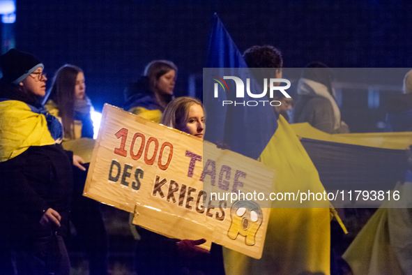 Two hundred people take part in a demonstration to mark 1,000 days since the full-scale war between Ukraine and Russia in Cologne, Germany,...