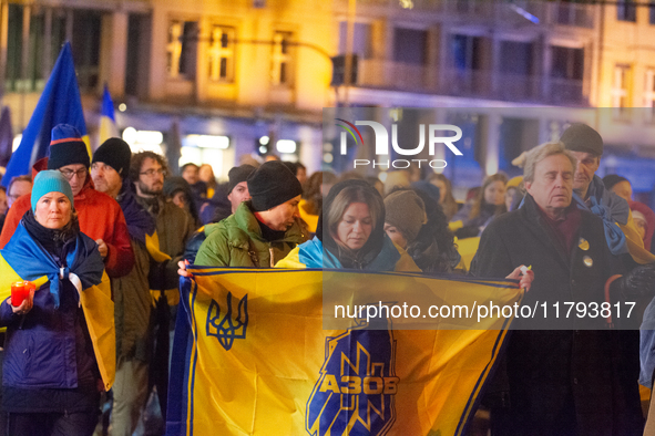 Two hundred people take part in a demonstration to mark 1,000 days since the full-scale war between Ukraine and Russia in Cologne, Germany,...