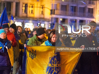 Two hundred people take part in a demonstration to mark 1,000 days since the full-scale war between Ukraine and Russia in Cologne, Germany,...