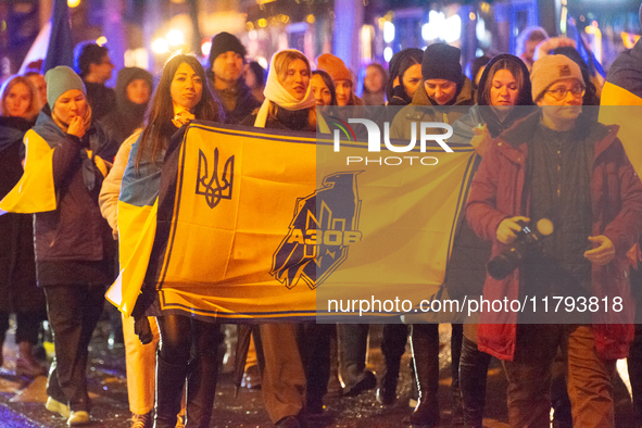 Two hundred people take part in a demonstration to mark 1,000 days since the full-scale war between Ukraine and Russia in Cologne, Germany,...