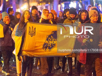 Two hundred people take part in a demonstration to mark 1,000 days since the full-scale war between Ukraine and Russia in Cologne, Germany,...