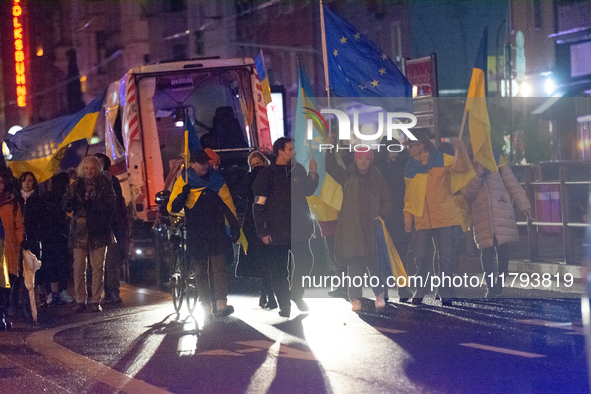 Two hundred people take part in a demonstration to mark 1,000 days since the full-scale war between Ukraine and Russia in Cologne, Germany,...