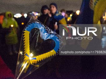 Two hundred people take part in a demonstration to mark 1,000 days since the full-scale war between Ukraine and Russia in Cologne, Germany,...