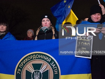 Two hundred people take part in a demonstration to mark 1,000 days since the full-scale war between Ukraine and Russia in Cologne, Germany,...