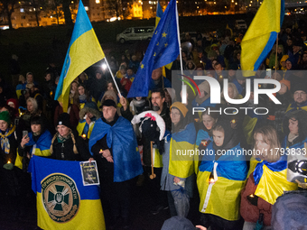 Two hundred people take part in a demonstration to mark 1,000 days since the full-scale war between Ukraine and Russia in Cologne, Germany,...