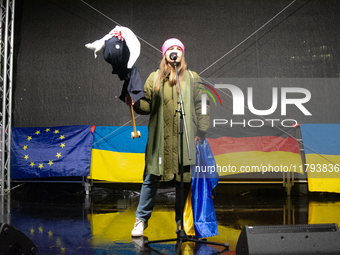 A protester holds a symbolic Taurus toy to demand the German government supply Ukraine with Taurus missiles on the stage as two hundred peop...