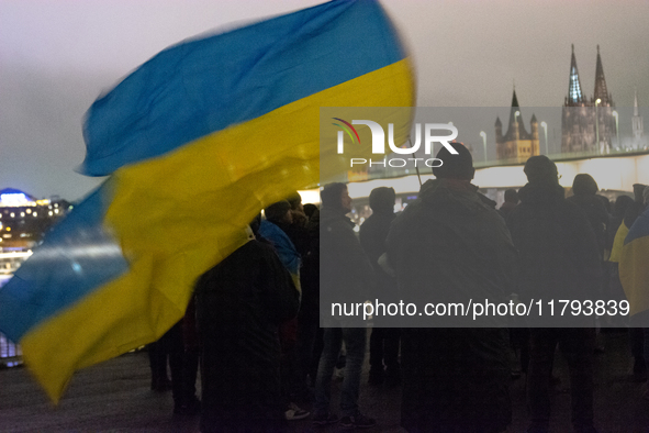 Two hundred people take part in a demonstration to mark 1,000 days since the full-scale war between Ukraine and Russia in Cologne, Germany,...