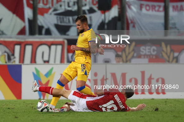 In Ta' Qali, Malta, on November 19, 2024, Moises San Nicolas of Andorra is closely challenged by Trent Buhagiar of Malta during the UEFA Nat...