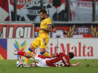 In Ta' Qali, Malta, on November 19, 2024, Moises San Nicolas of Andorra is closely challenged by Trent Buhagiar of Malta during the UEFA Nat...