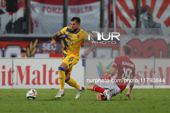 In Ta' Qali, Malta, on November 19, 2024, Moises San Nicolas of Andorra is closely challenged by Trent Buhagiar of Malta during the UEFA Nat...