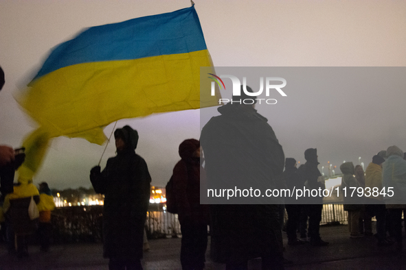 Two hundred people take part in a demonstration to mark 1,000 days since the full-scale war between Ukraine and Russia in Cologne, Germany,...