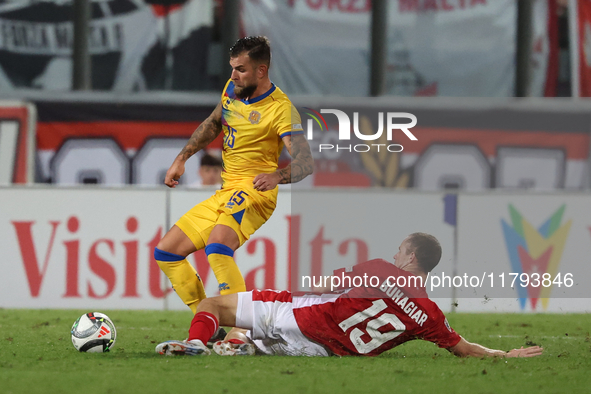 In Ta' Qali, Malta, on November 19, 2024, Moises San Nicolas of Andorra is closely challenged by Trent Buhagiar of Malta during the UEFA Nat...