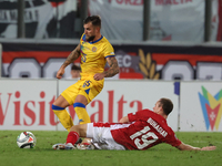 In Ta' Qali, Malta, on November 19, 2024, Moises San Nicolas of Andorra is closely challenged by Trent Buhagiar of Malta during the UEFA Nat...