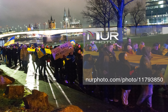 Two hundred people take part in a demonstration to mark 1,000 days since the full-scale war between Ukraine and Russia in Cologne, Germany,...