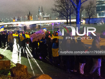 Two hundred people take part in a demonstration to mark 1,000 days since the full-scale war between Ukraine and Russia in Cologne, Germany,...