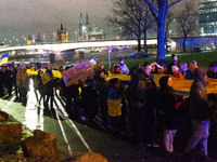 Two hundred people take part in a demonstration to mark 1,000 days since the full-scale war between Ukraine and Russia in Cologne, Germany,...