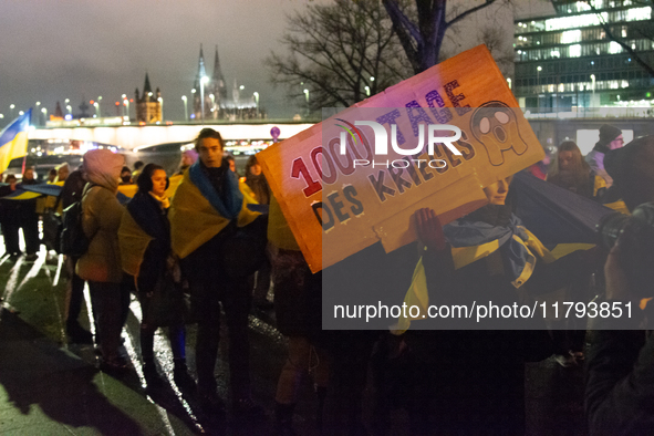 Two hundred people take part in a demonstration to mark 1,000 days since the full-scale war between Ukraine and Russia in Cologne, Germany,...