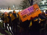 Two hundred people take part in a demonstration to mark 1,000 days since the full-scale war between Ukraine and Russia in Cologne, Germany,...