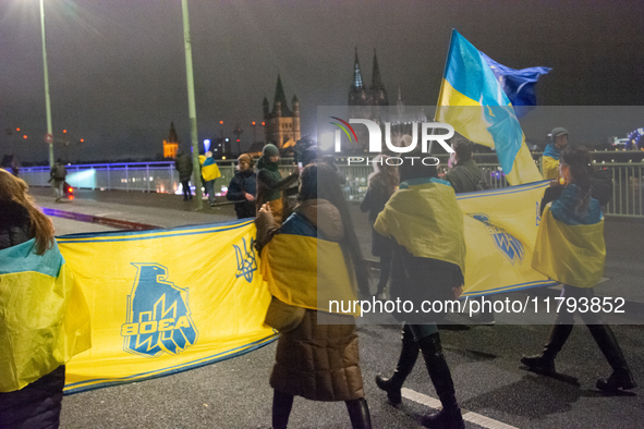 Two hundred people take part in a demonstration to mark 1,000 days since the full-scale war between Ukraine and Russia in Cologne, Germany,...