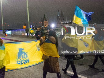 Two hundred people take part in a demonstration to mark 1,000 days since the full-scale war between Ukraine and Russia in Cologne, Germany,...