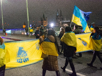 Two hundred people take part in a demonstration to mark 1,000 days since the full-scale war between Ukraine and Russia in Cologne, Germany,...