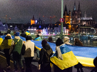 Two hundred people take part in a demonstration to mark 1,000 days since the full-scale war between Ukraine and Russia in Cologne, Germany,...