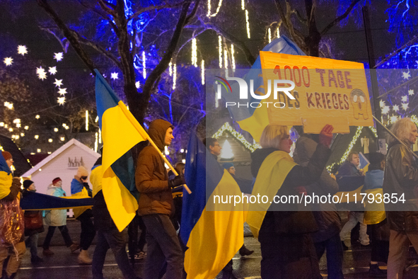 Two hundred people take part in a demonstration to mark 1,000 days since the full-scale war between Ukraine and Russia in Cologne, Germany,...