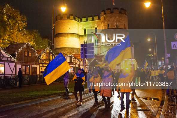 Two hundred people take part in a demonstration to mark 1,000 days since the full-scale war between Ukraine and Russia in Cologne, Germany,...