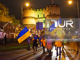 Two hundred people take part in a demonstration to mark 1,000 days since the full-scale war between Ukraine and Russia in Cologne, Germany,...