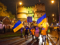 Two hundred people take part in a demonstration to mark 1,000 days since the full-scale war between Ukraine and Russia in Cologne, Germany,...