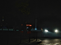 Silhouettes of people appear on the street during a power outage in Odesa, Ukraine, on November 18, 2024. (