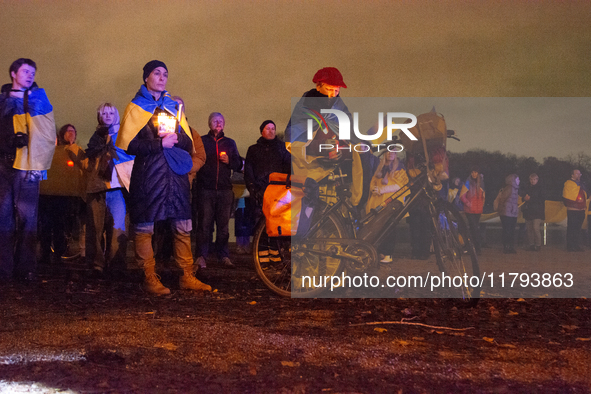 Two hundred people take part in a demonstration to mark 1,000 days since the full-scale war between Ukraine and Russia in Cologne, Germany,...