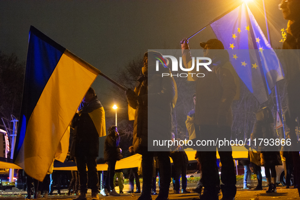 Two hundred people take part in a demonstration to mark 1,000 days since the full-scale war between Ukraine and Russia in Cologne, Germany,...