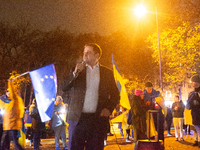 Nathanael Liminski, the state minister of international affairs, speaks to the protesters as two hundred people take part in a demonstration...