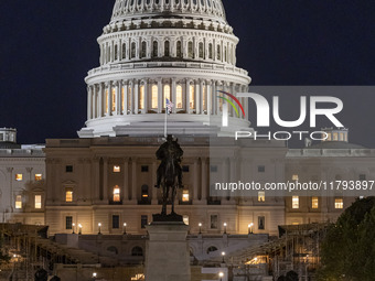 Night view with dark sky of the illuminated US Capitol reflecting on the pool water surface. The Capitol is the seat of the United States Co...