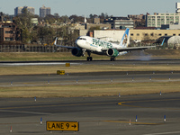 Frontier Airlines Airbus A320neo passenger aircraft spotted on final approach flying, landing and taxiing on the runway and taxiway of LaGua...