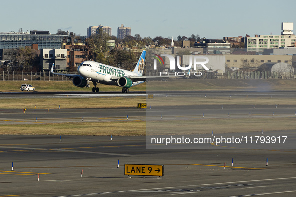 Frontier Airlines Airbus A320neo passenger aircraft spotted on final approach flying, landing and taxiing on the runway and taxiway of LaGua...