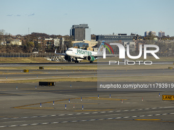 Frontier Airlines Airbus A320neo passenger aircraft spotted on final approach flying, landing and taxiing on the runway and taxiway of LaGua...