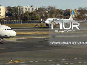 Frontier Airlines Airbus A320neo passenger aircraft spotted on final approach flying, landing and taxiing on the runway and taxiway of LaGua...