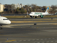 Frontier Airlines Airbus A320neo passenger aircraft spotted on final approach flying, landing and taxiing on the runway and taxiway of LaGua...