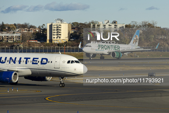 Frontier Airlines Airbus A320neo passenger aircraft spotted on final approach flying, landing and taxiing on the runway and taxiway of LaGua...