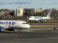 Frontier Airlines Airbus A320neo passenger aircraft spotted on final approach flying, landing and taxiing on the runway and taxiway of LaGua...