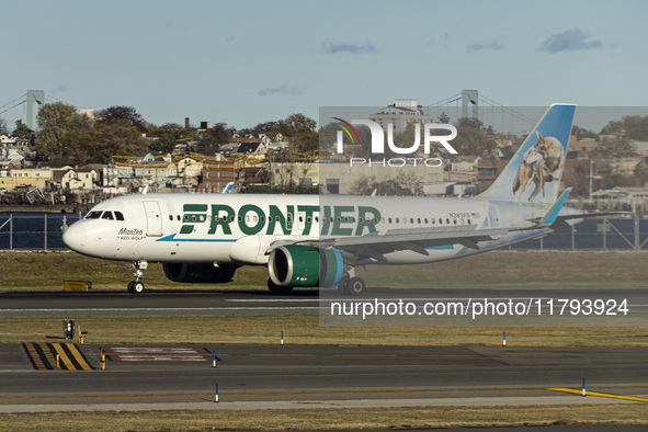 Frontier Airlines Airbus A320neo passenger aircraft spotted on final approach flying, landing and taxiing on the runway and taxiway of LaGua...