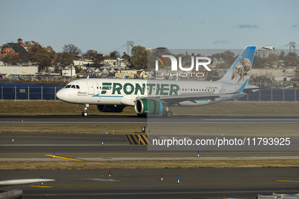 Frontier Airlines Airbus A320neo passenger aircraft spotted on final approach flying, landing and taxiing on the runway and taxiway of LaGua...