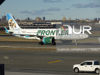 Frontier Airlines Airbus A320neo passenger aircraft spotted on final approach flying, landing and taxiing on the runway and taxiway of LaGua...