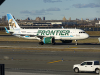 Frontier Airlines Airbus A320neo passenger aircraft spotted on final approach flying, landing and taxiing on the runway and taxiway of LaGua...