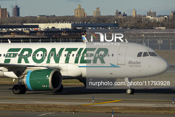 Frontier Airlines Airbus A320neo passenger aircraft spotted on final approach flying, landing and taxiing on the runway and taxiway of LaGua...