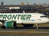 Frontier Airlines Airbus A320neo passenger aircraft spotted on final approach flying, landing and taxiing on the runway and taxiway of LaGua...