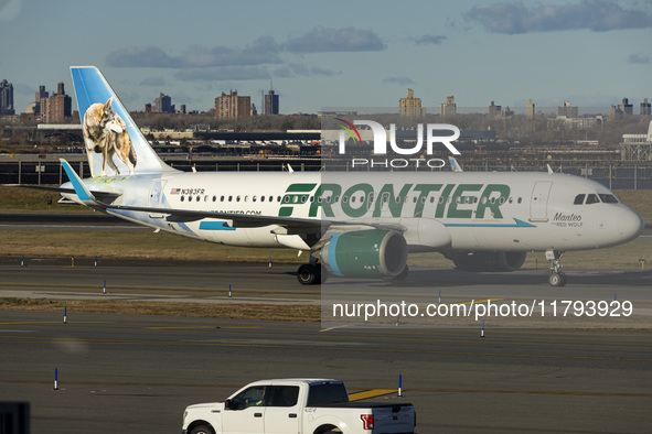 Frontier Airlines Airbus A320neo passenger aircraft spotted on final approach flying, landing and taxiing on the runway and taxiway of LaGua...